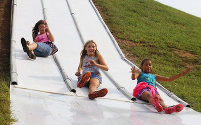 Three Guests Slide Down Slide