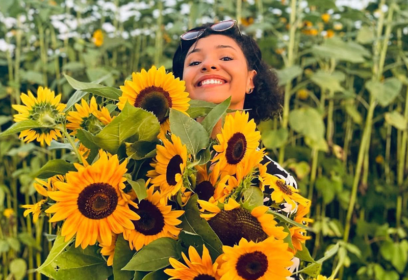 Guest With A Bunch Of Sunflowers