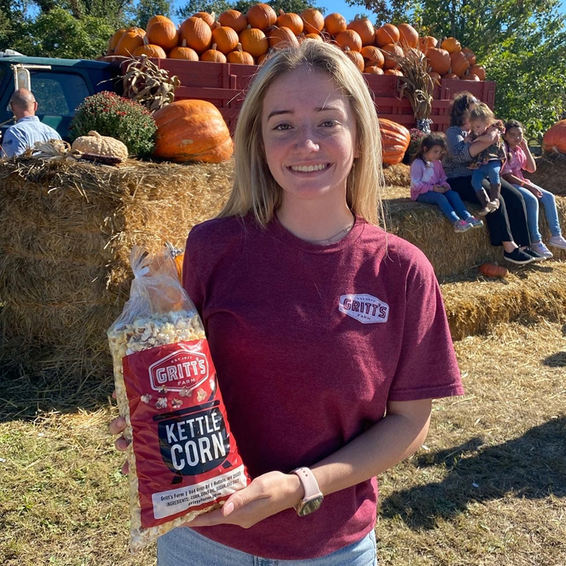 Smiling Employee With Kettle Corn