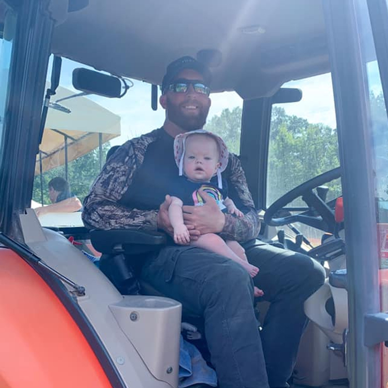 Bobby Gritt On Tractor With Child